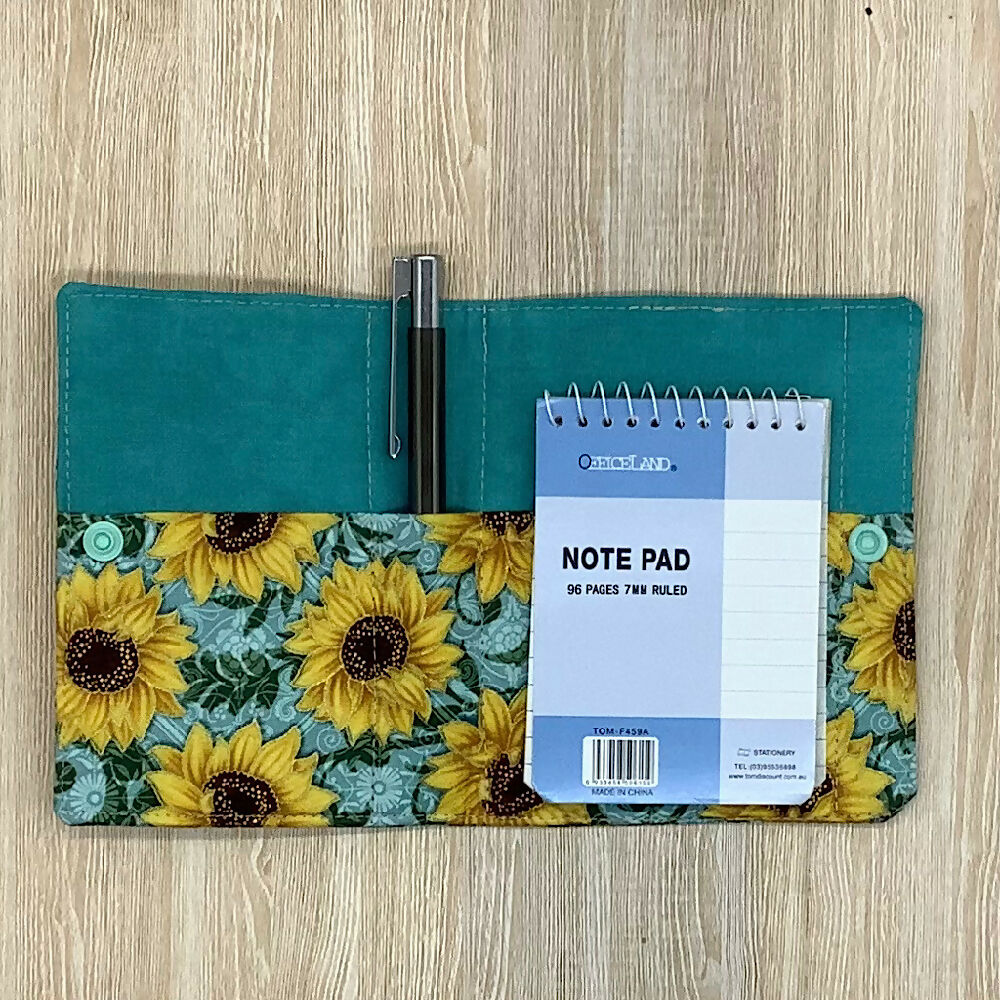 Sunflowers refillable fabric pocket notepad cover with snap closure. Incl. book and pen.