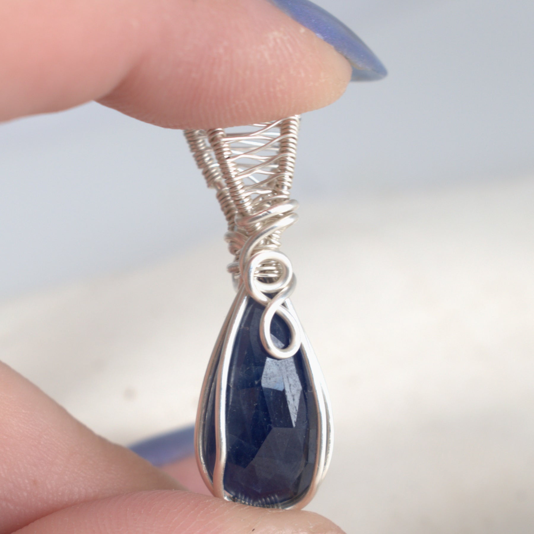 After Dark – Blue Sapphire Pendant in Silver-Filled Wire