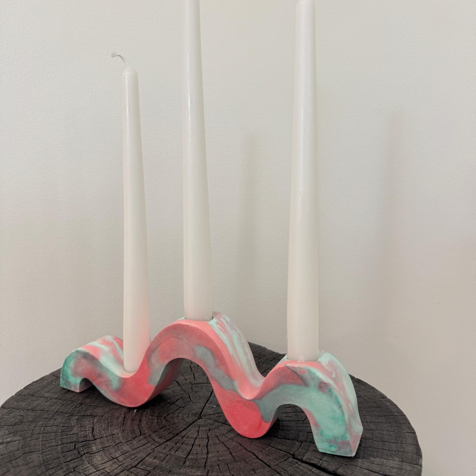 Red and green and gold wavy concrete holder for taper candles