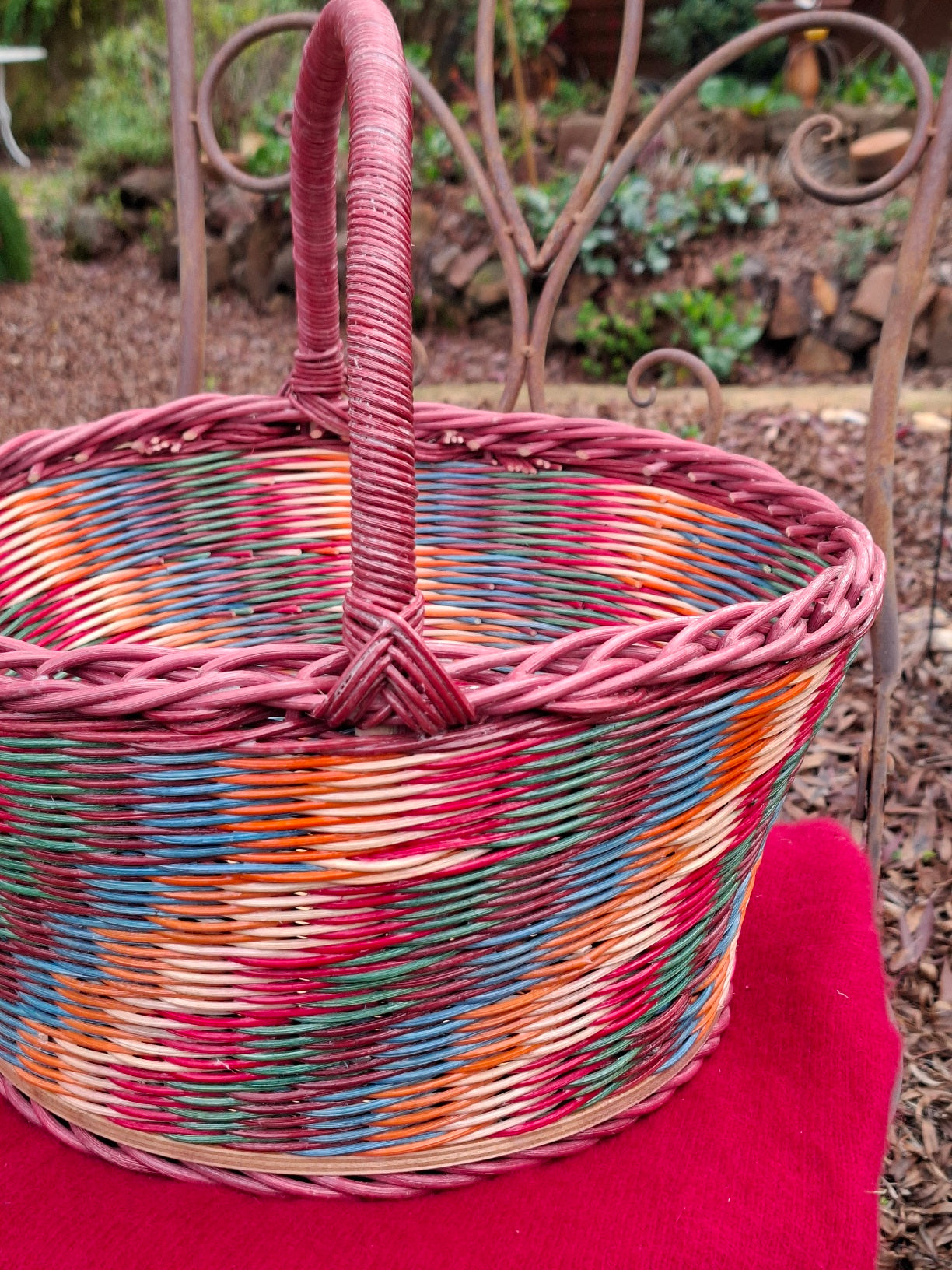 Large Round Market Basket brown, blue, orange, red and natural. Handle brown.