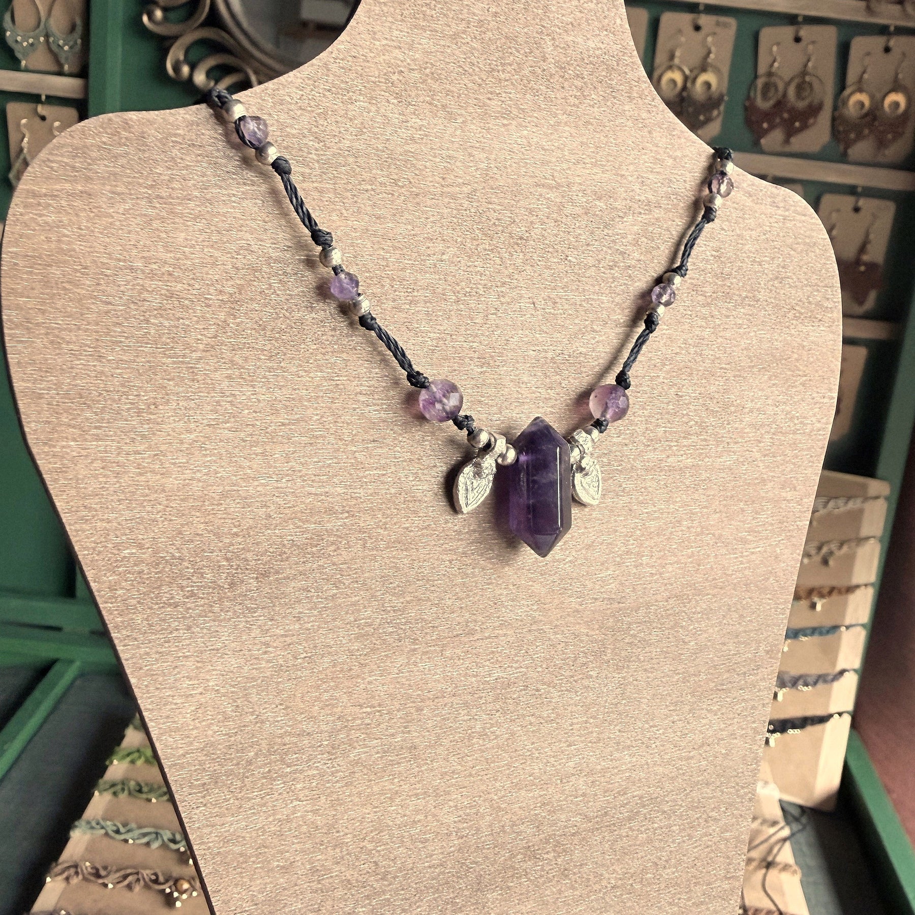 Crystal point necklace with faceted beads and solid brass charm