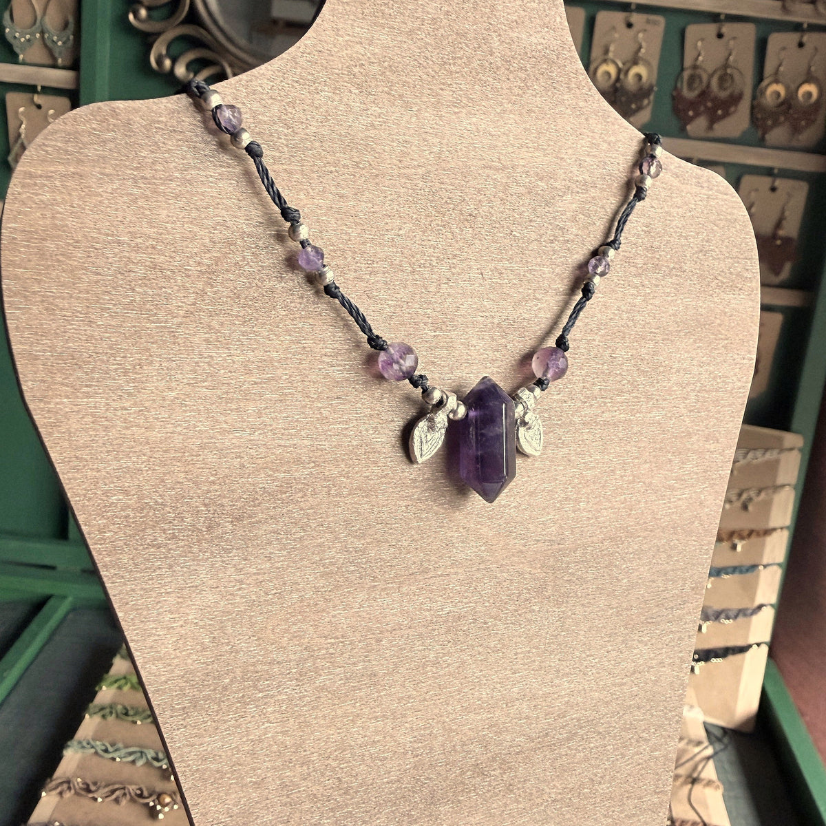 Crystal point necklace with faceted beads and solid brass charm