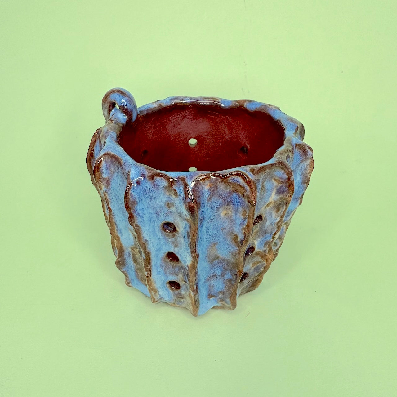 Ceramic orchid pot with vertical ridges