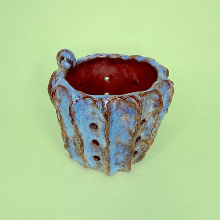 Ceramic orchid pot with vertical ridges