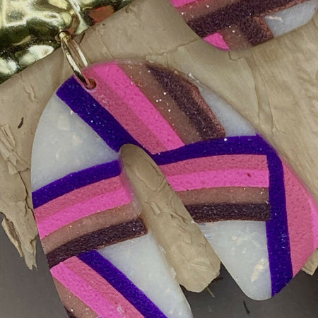 Magenta rainbow arch dangle earrings