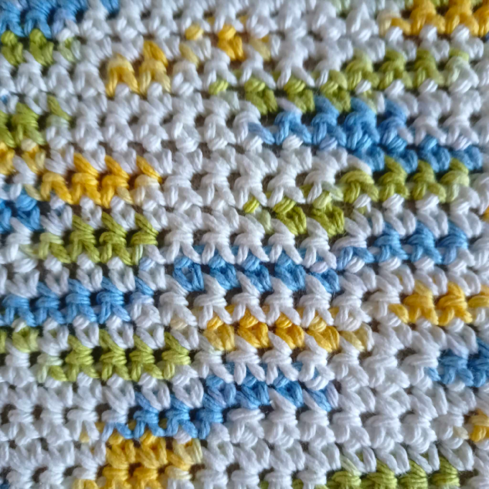 White Yellow Green Blue Dish Cloth showing stitches 6.6.2024