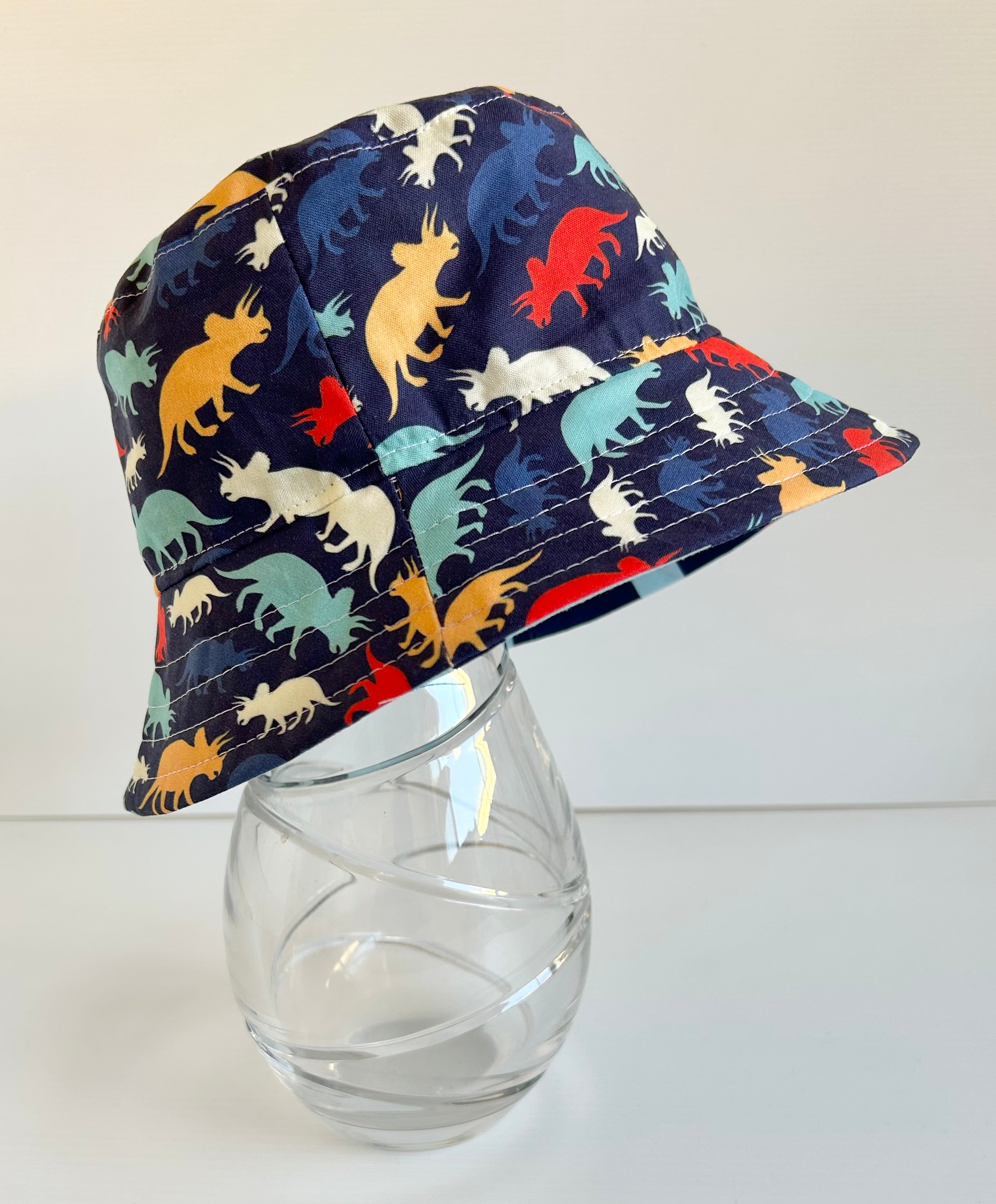 Summer hat in colourful dino fabric