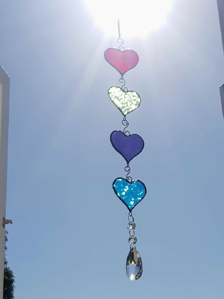 four colourful stained glass hanging hearts, hanging chain of hearts