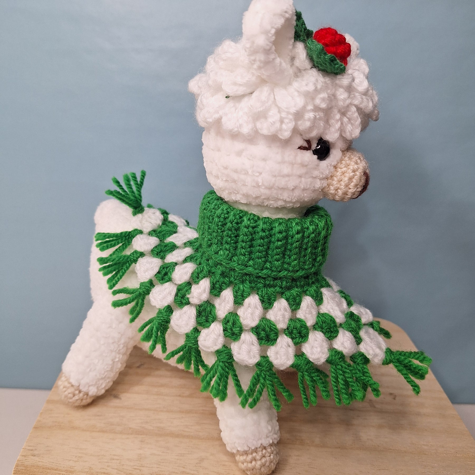 Crocheted Christmas Alpaca wearing a Poncho