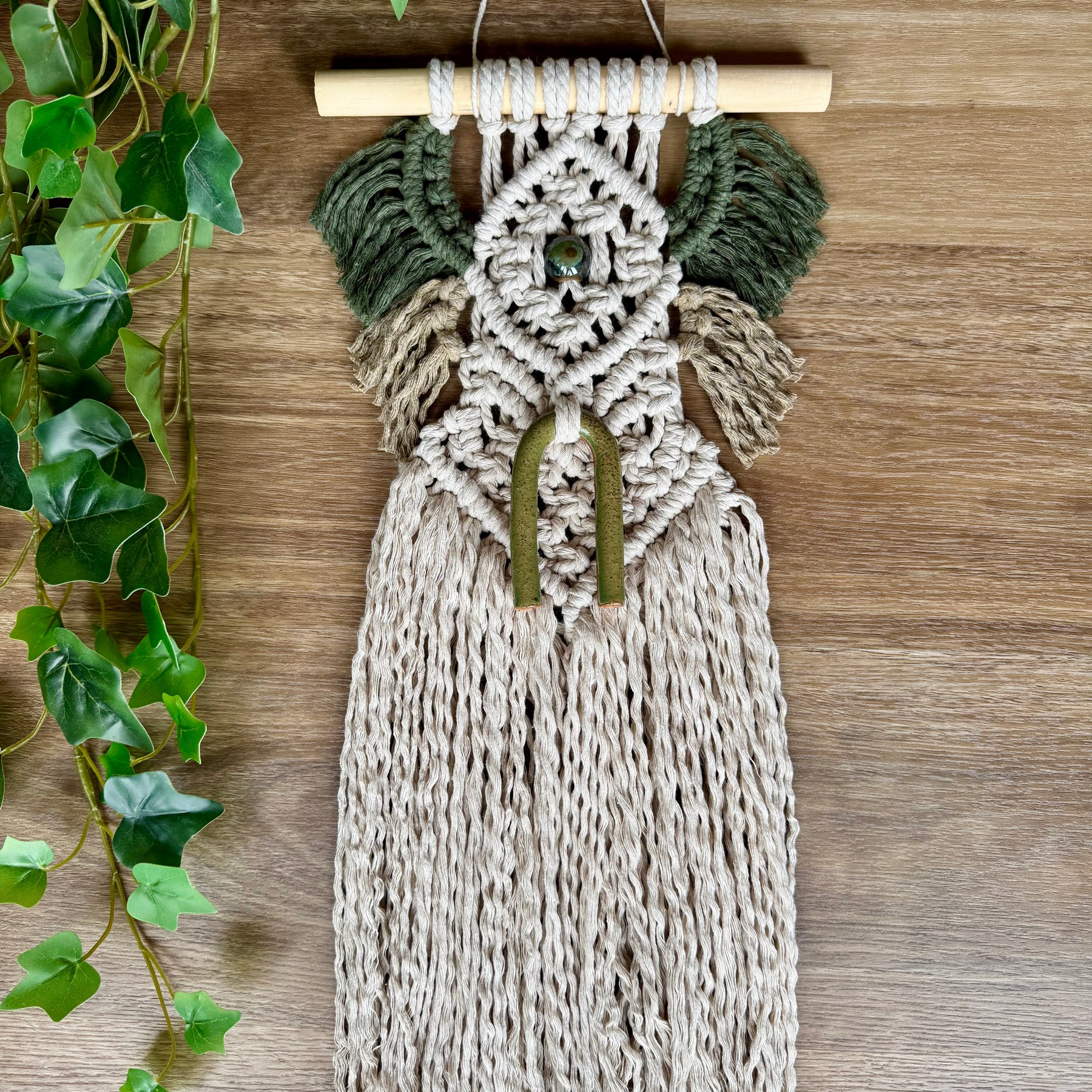 Macrame wall hanging with clay bead detail