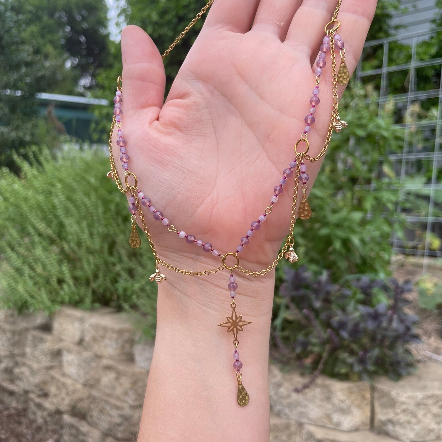 Pink and gold beaded bee charm necklace