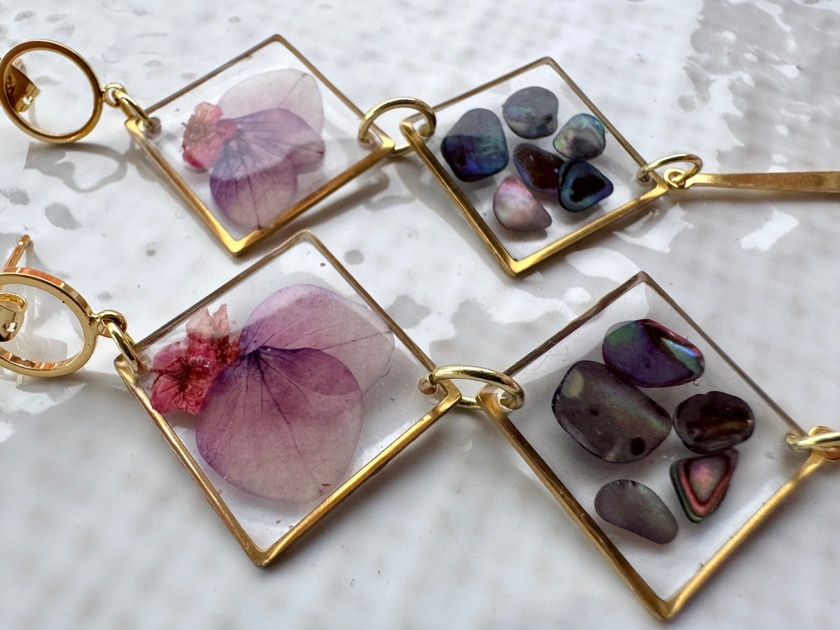 Double rhombus cowrie shell and pressed flower resin earrings