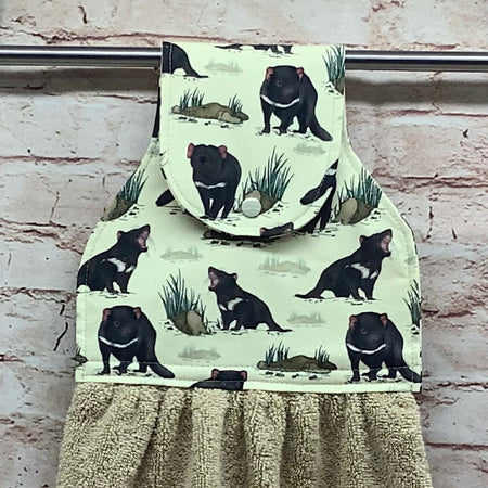Tasmanian Devils hanging hand towel with fabric and loop top.
