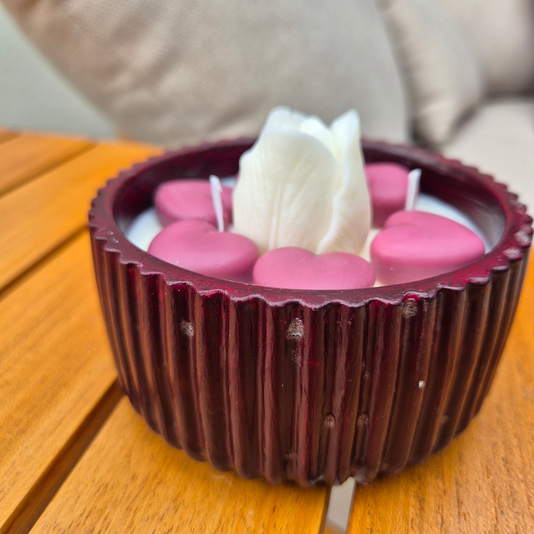 Round burgundy concrete bowl candle with tulip flower