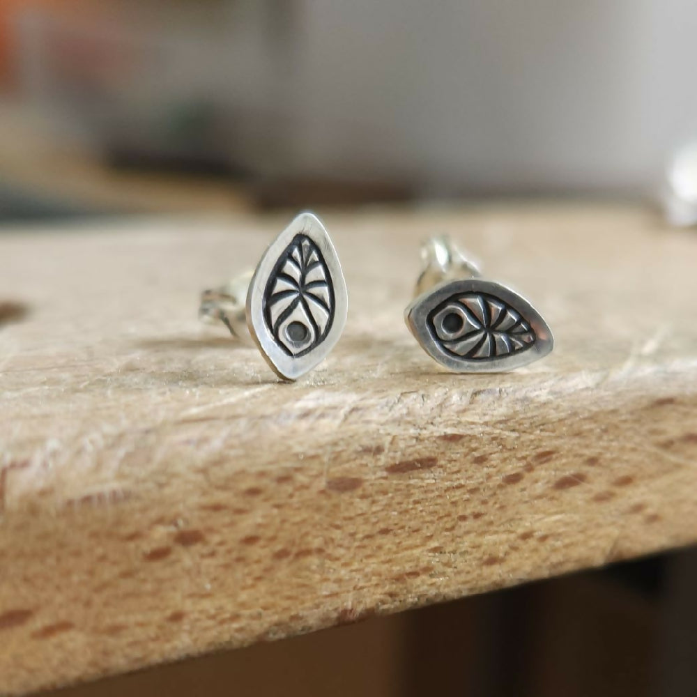 Tiny sterling silver studs with leafy pattern