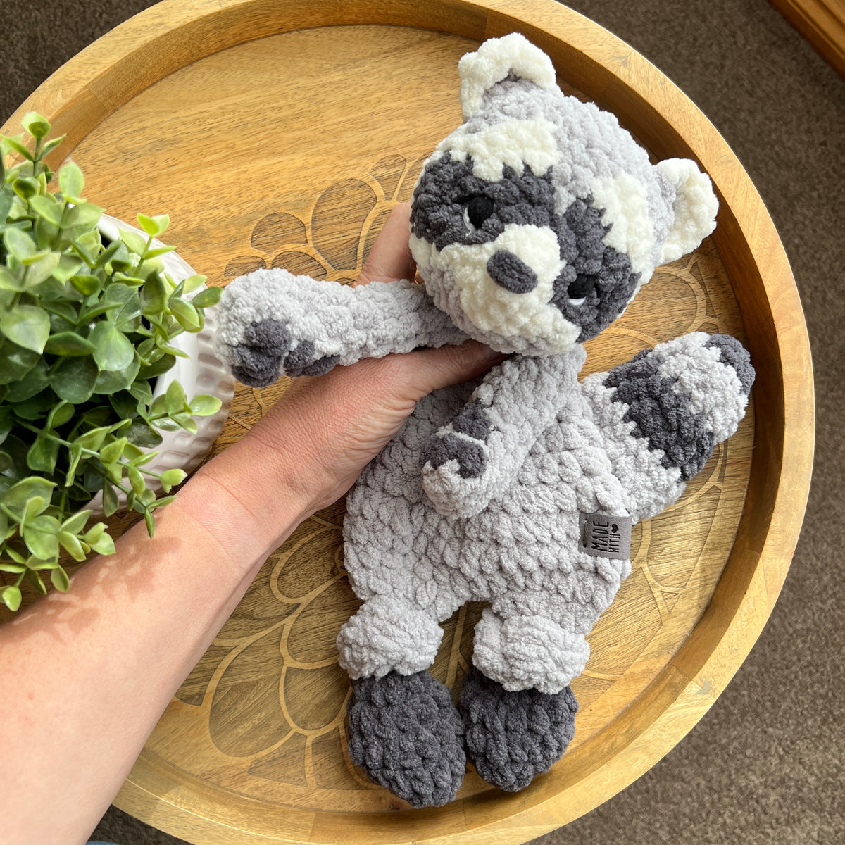 Handmade crochet modern Raccoon lovey snuggler with knotted legs.