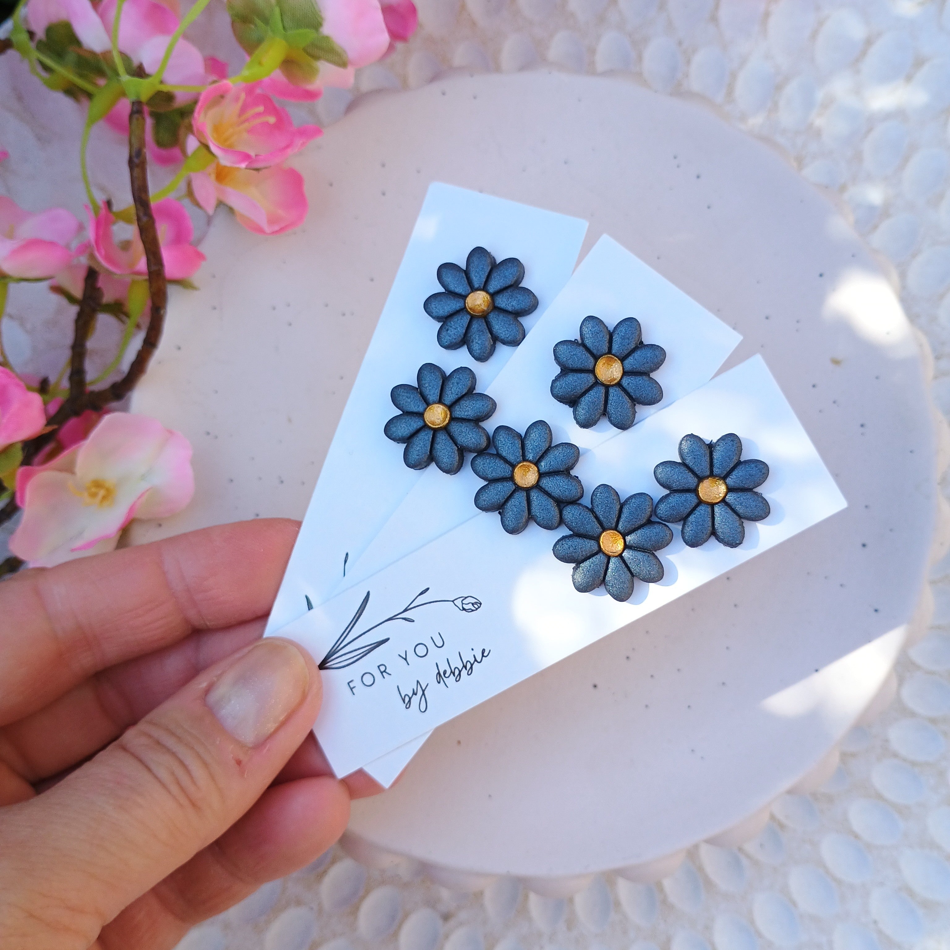 Metallic blue and gold flower stud earrings