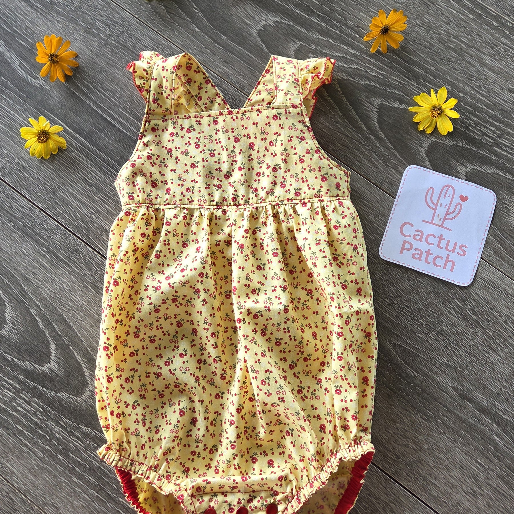 "Sunshine & Petals" Crossover Back Romper - Size 12 Months