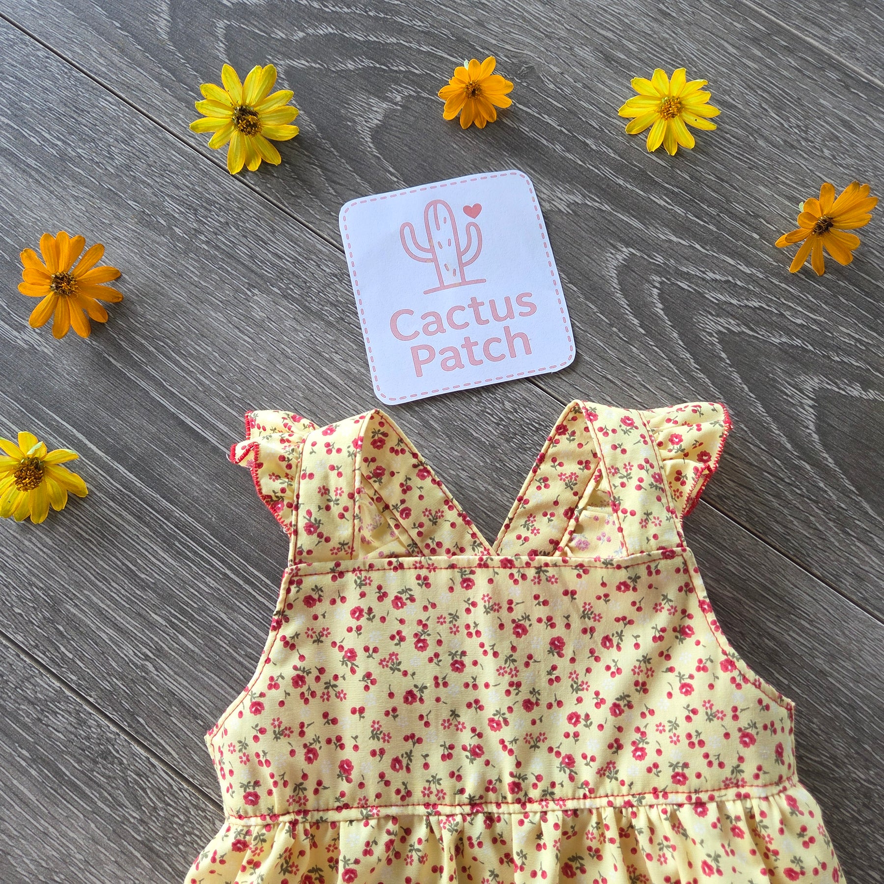 "Sunshine & Petals" Crossover Back Romper - Size 12 Months