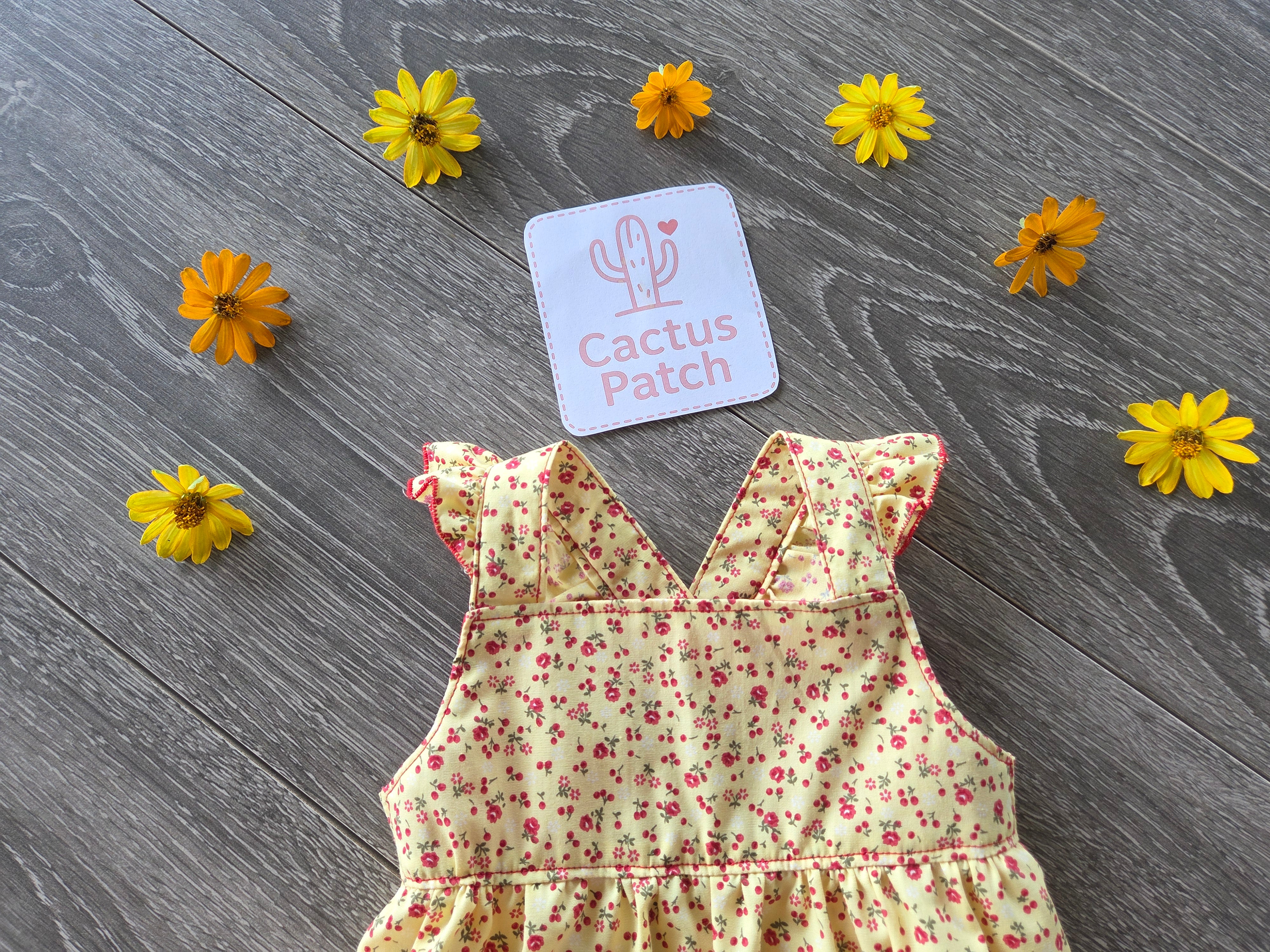 "Sunshine & Petals" Crossover Back Romper - Size 12 Months