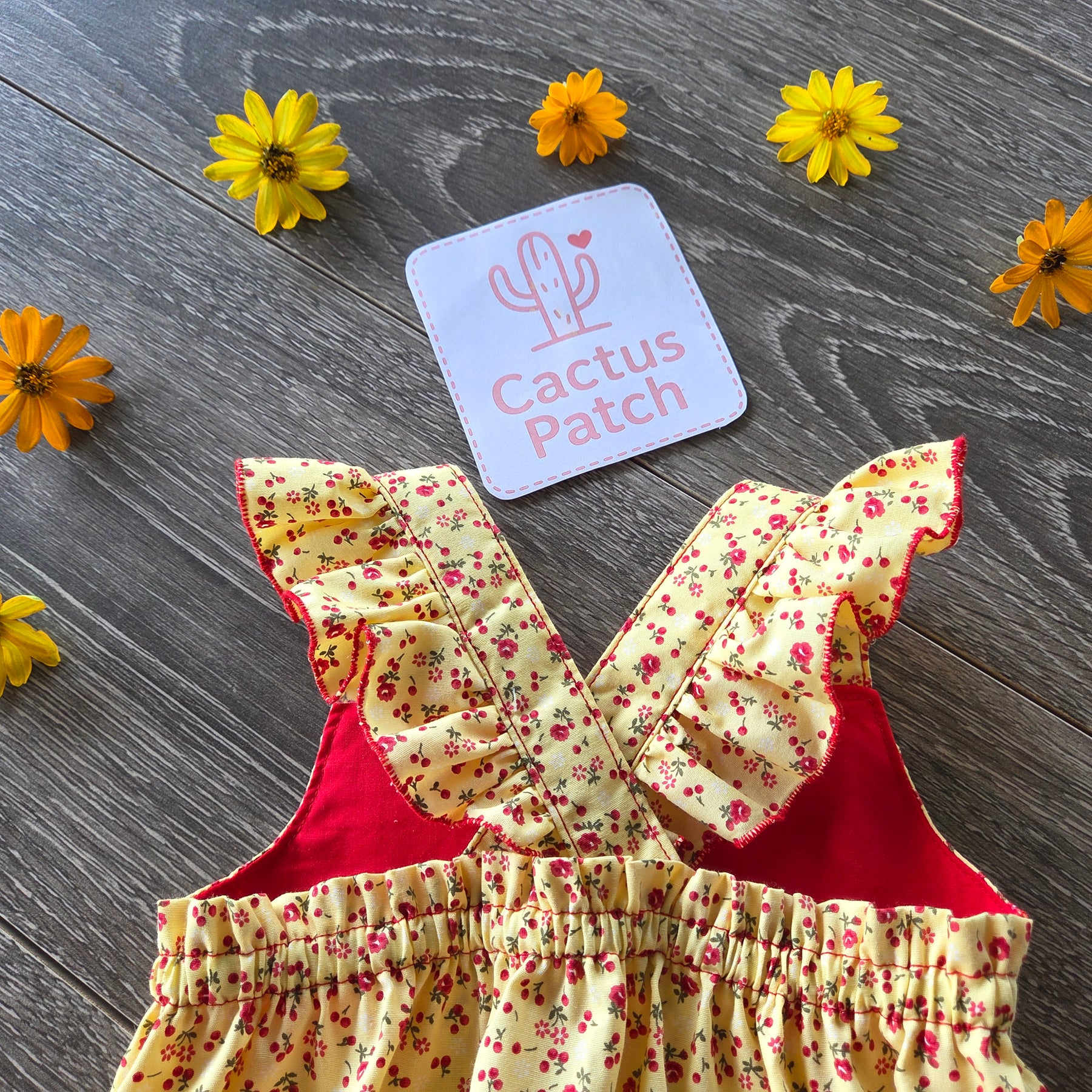 "Sunshine & Petals" Crossover Back Romper - Size 12 Months