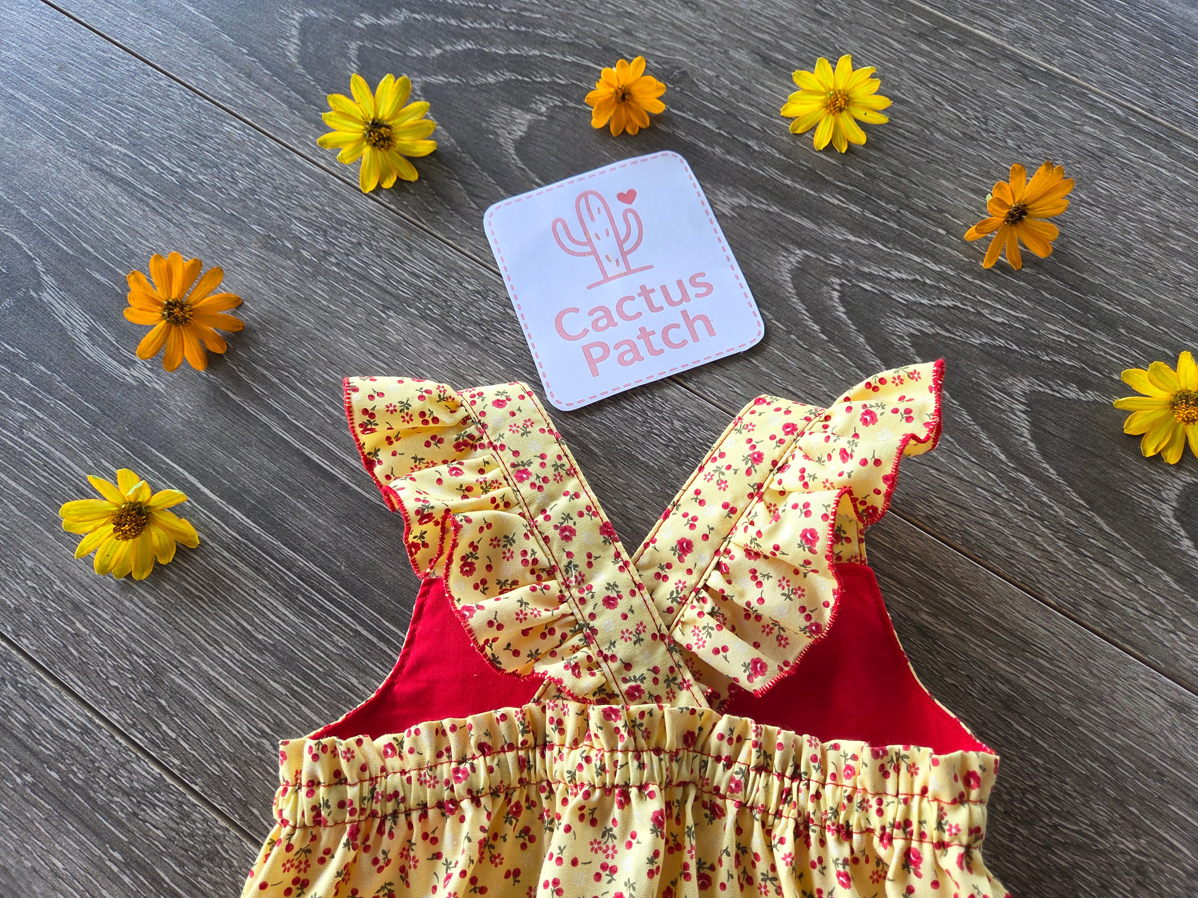 "Sunshine & Petals" Crossover Back Romper - Size 12 Months