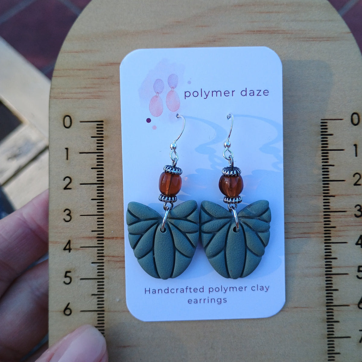 Beaded leaf dangle earrings