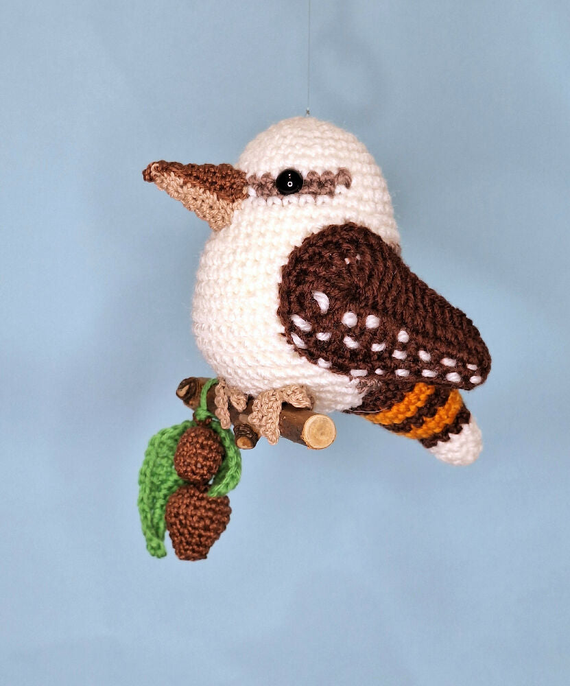 Crocheted laughing Kookaburra room decoration on perch