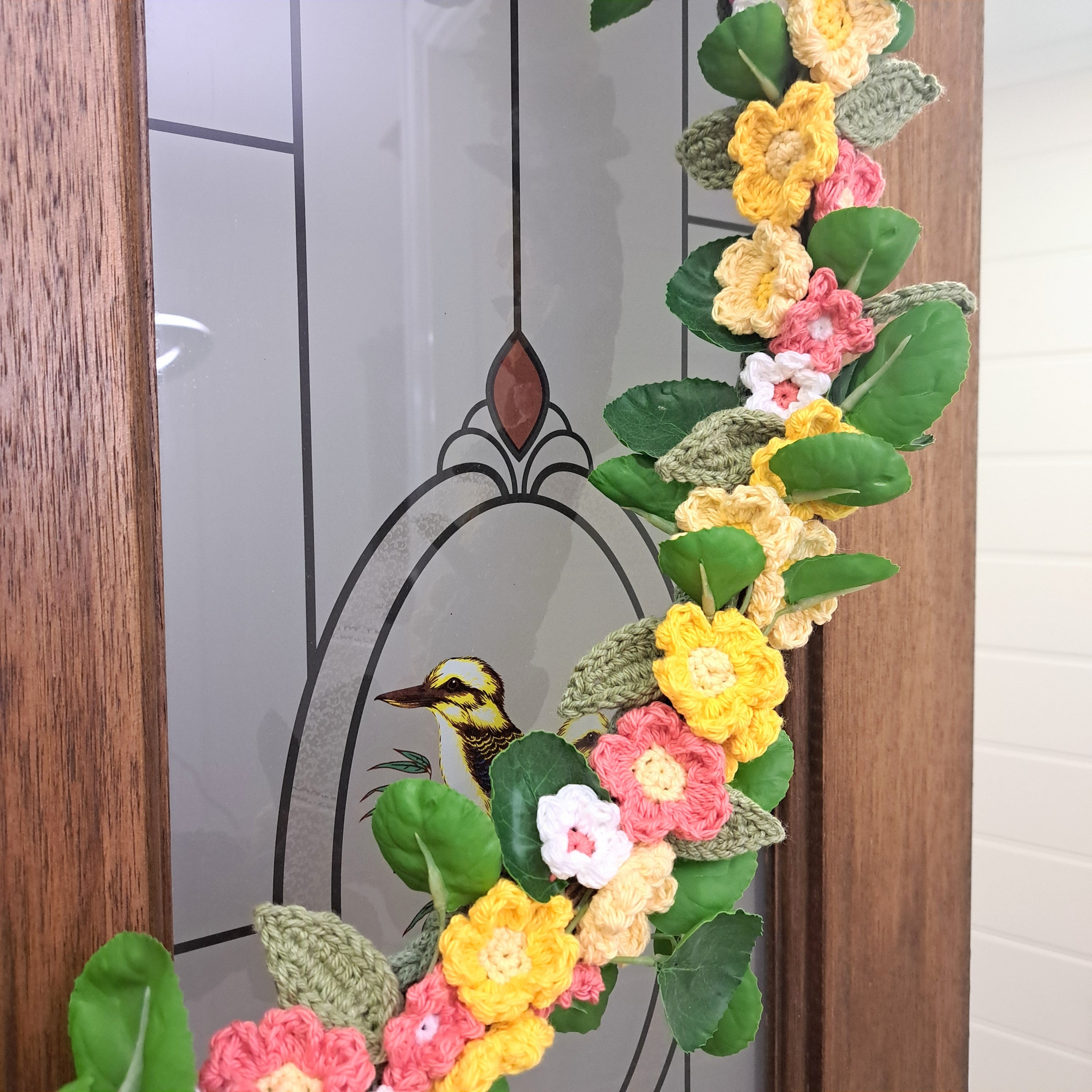 Handmade crochet spring flower wreath, yellows, pinks, white