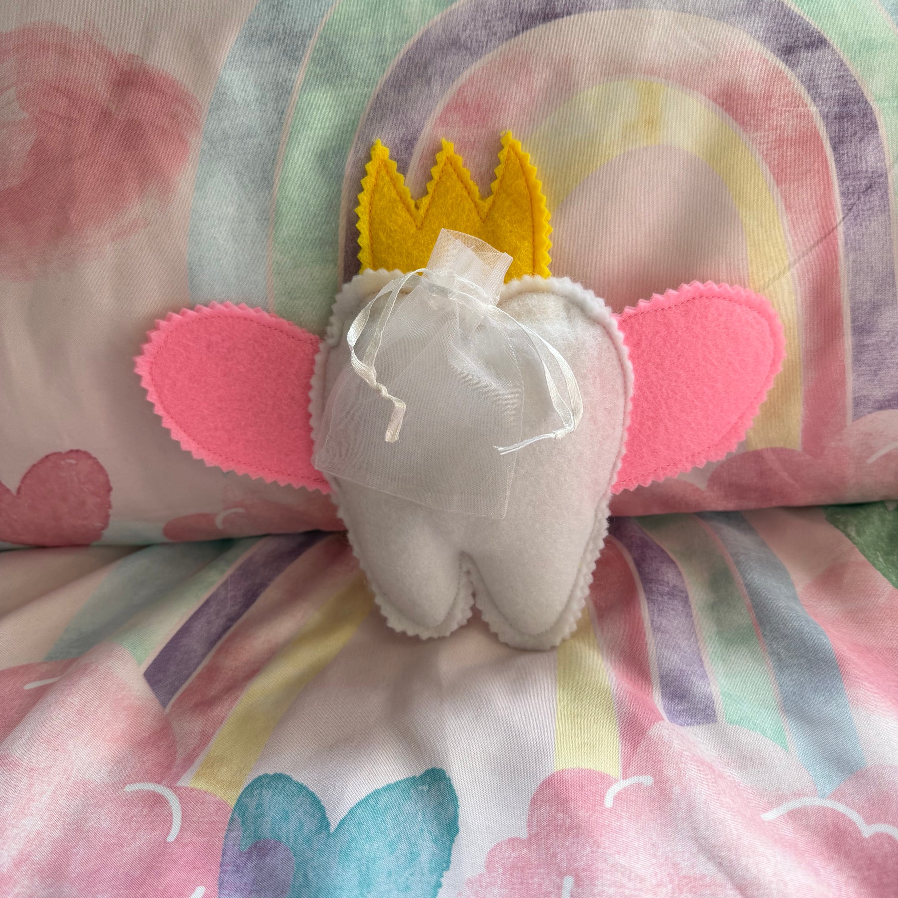 Tooth fairy snuggle toy with tooth pouch
