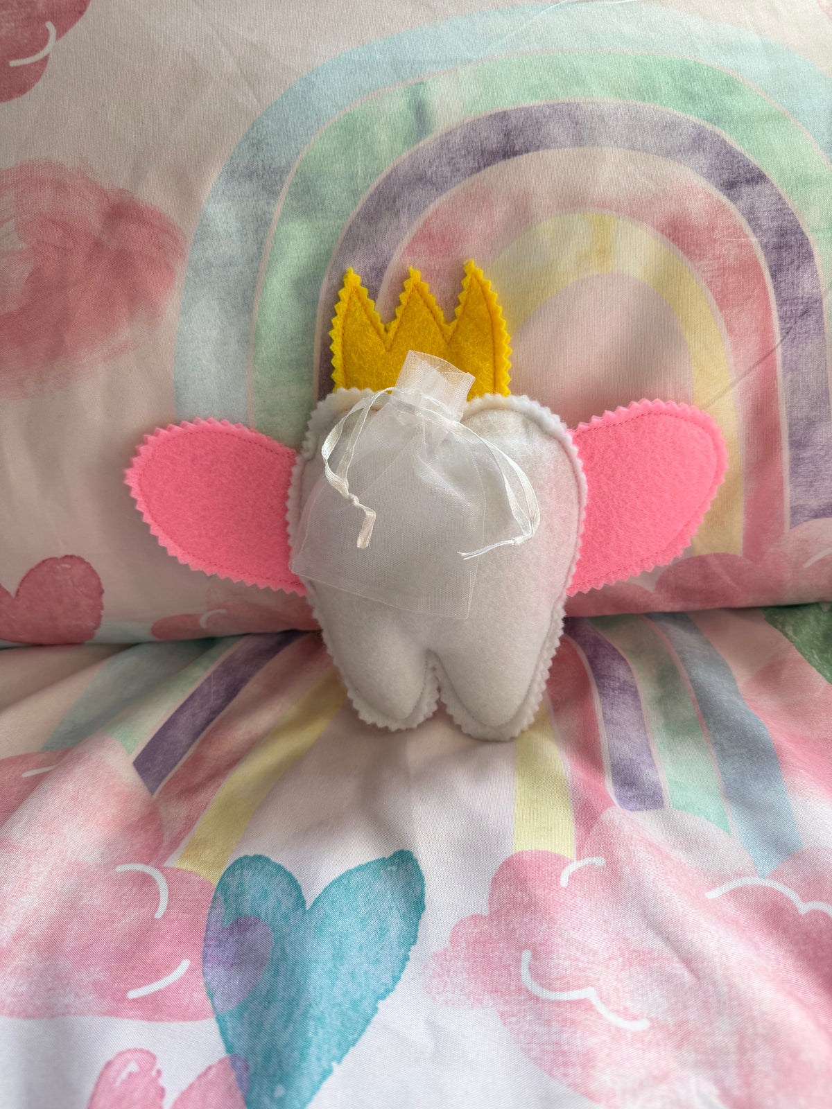 Tooth fairy snuggle toy with tooth pouch