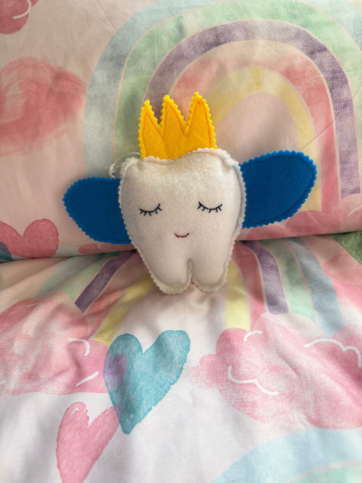 Tooth fairy snuggle toy with tooth pouch