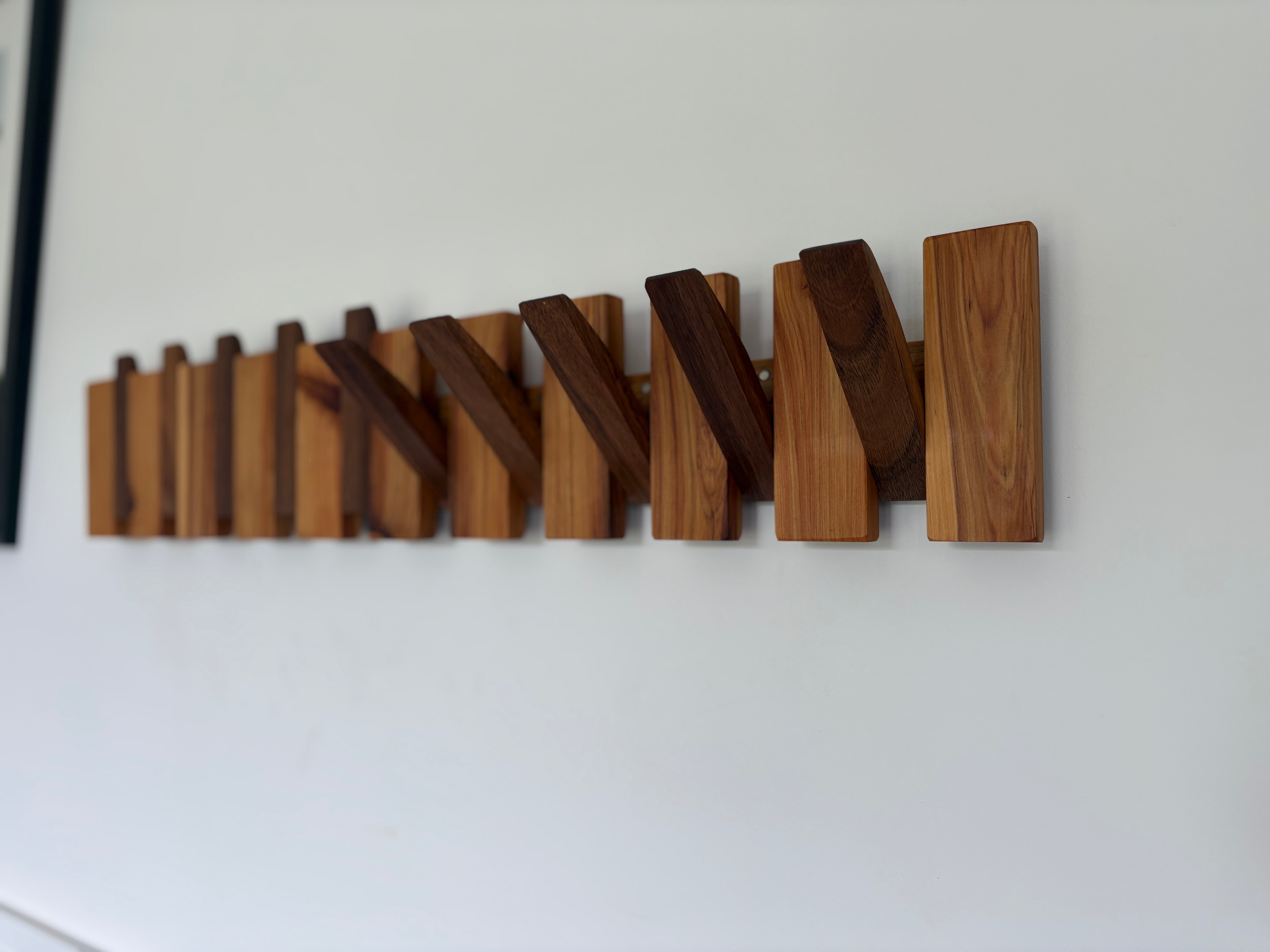 Two tone piano style coatrack