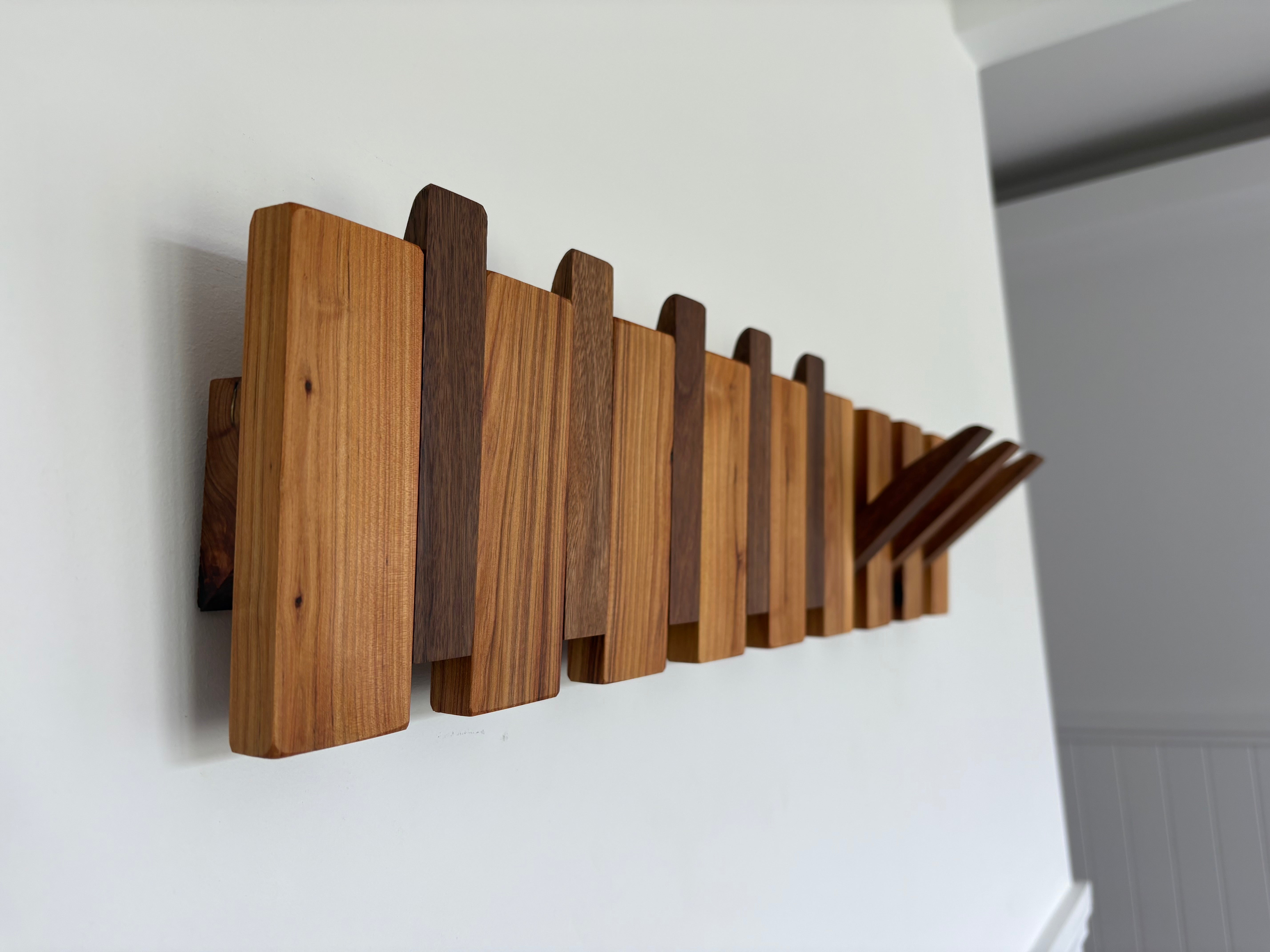 Two tone piano style coatrack