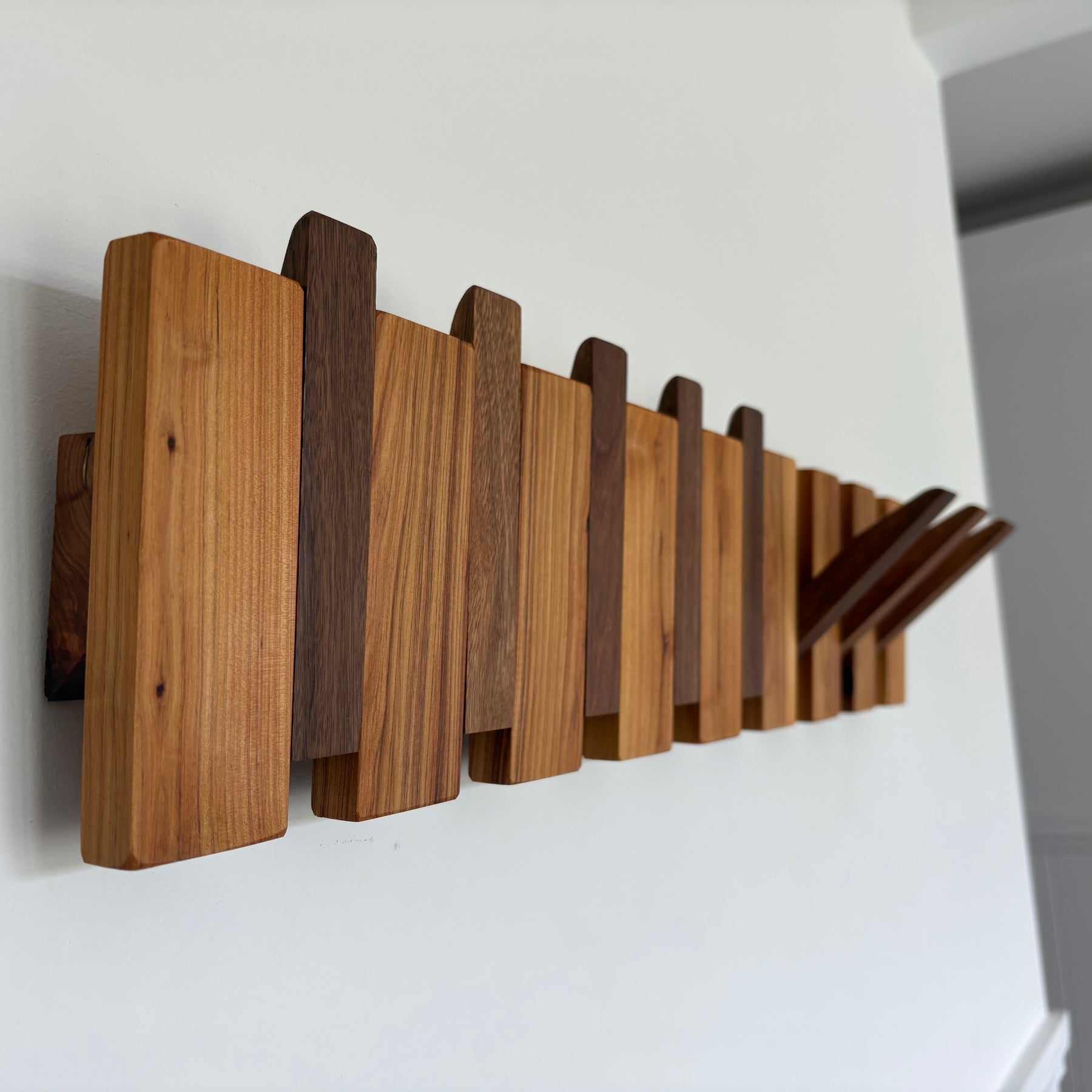 Two tone piano style coatrack