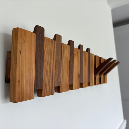 Two tone piano style coatrack