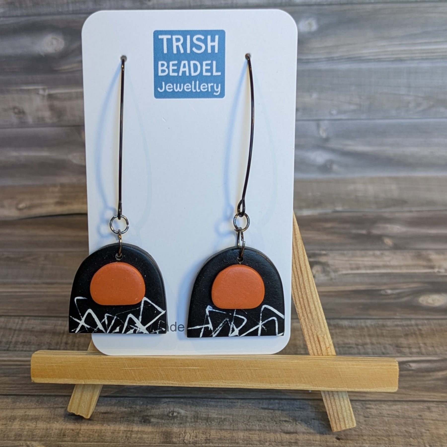 Black & orange arch earrings