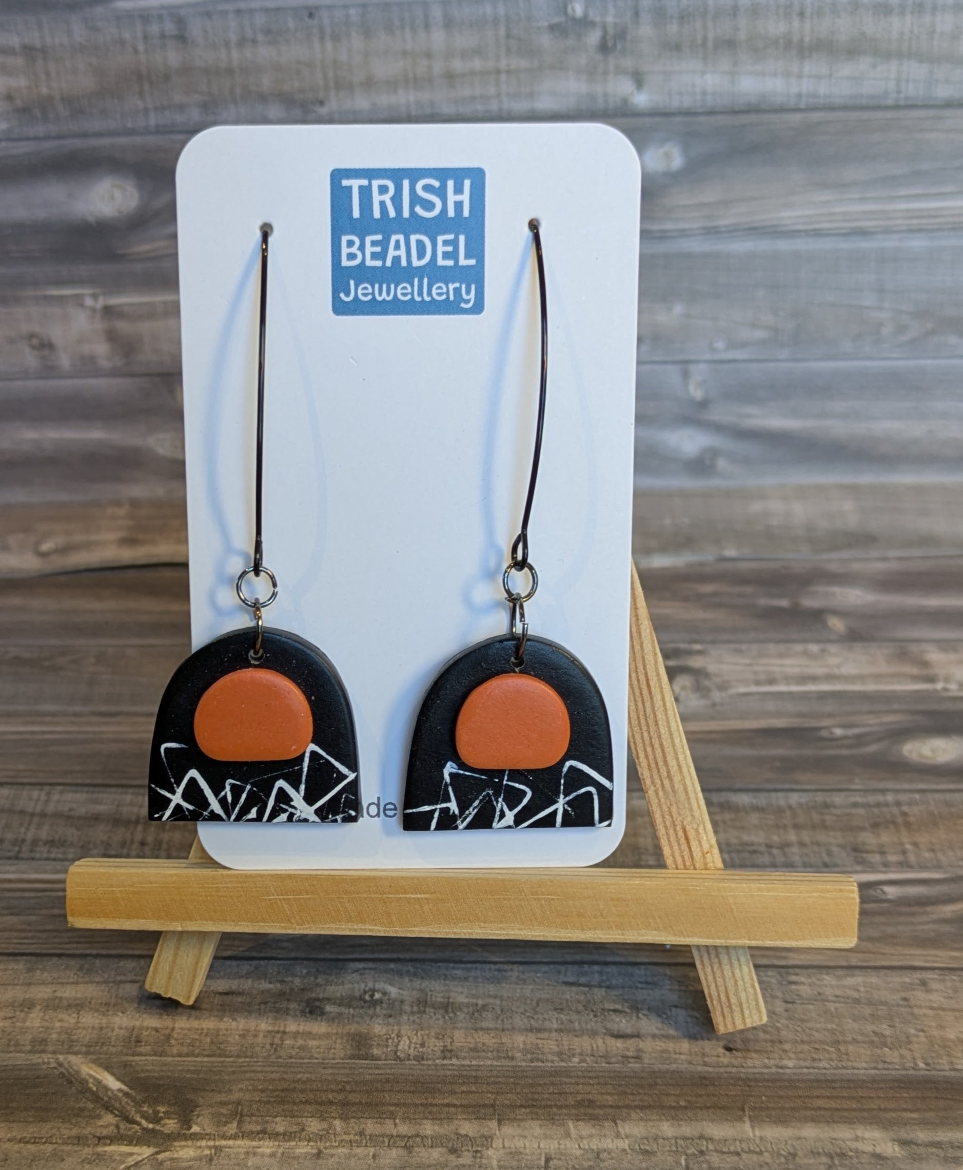 Black & orange arch earrings