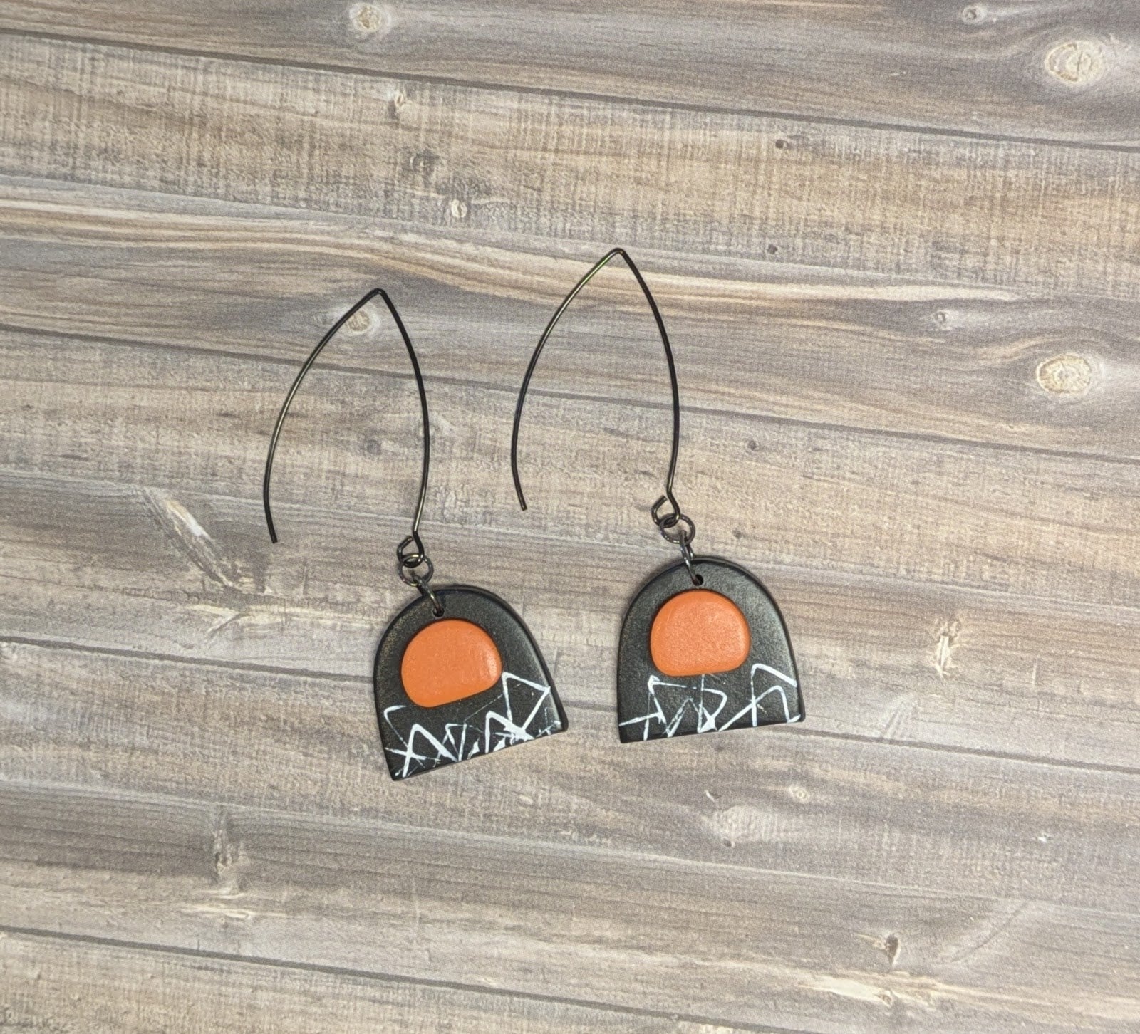Black & orange arch earrings