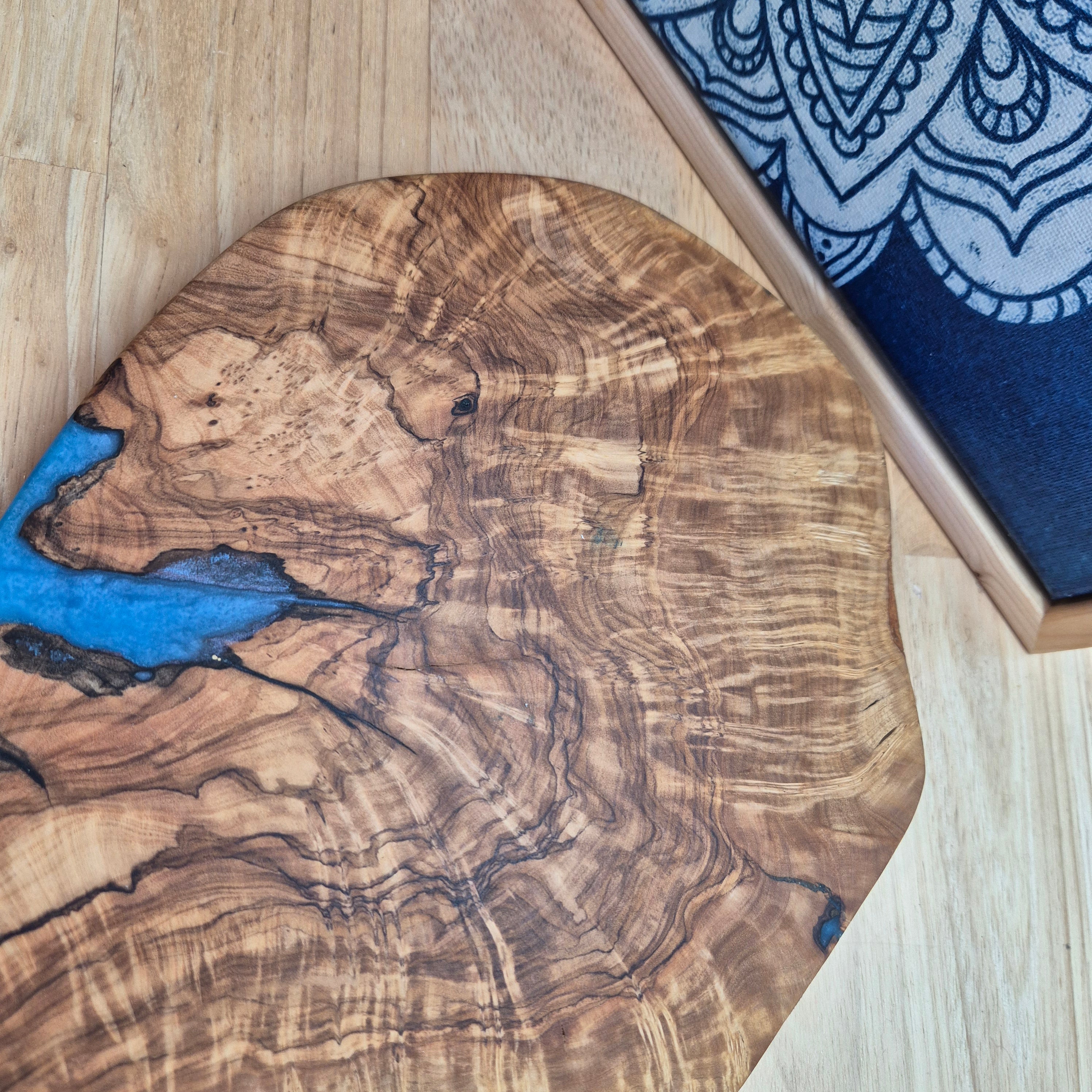 Olivewood serving board with blue resin infill