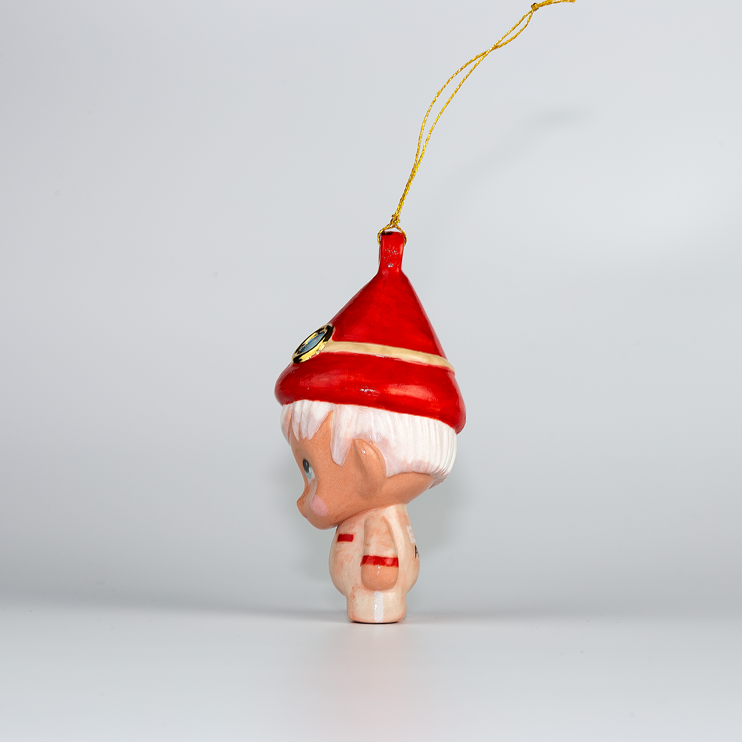 Handmade Porcelain Christmas ornament. One-of-a-kind. Zac, the sleigh mechanic Elf.
