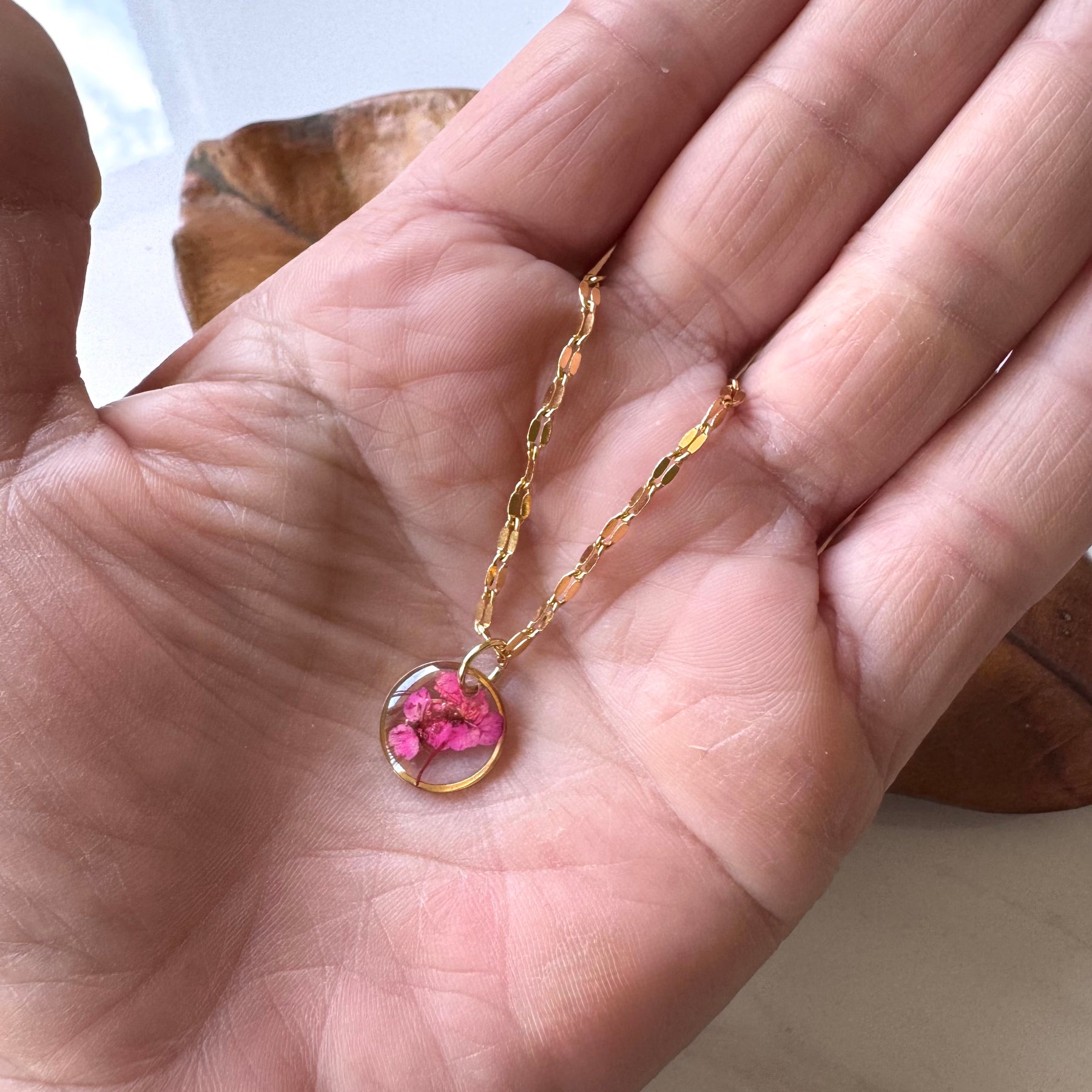 Gold plated resin necklace with fuchsia pink wildflower