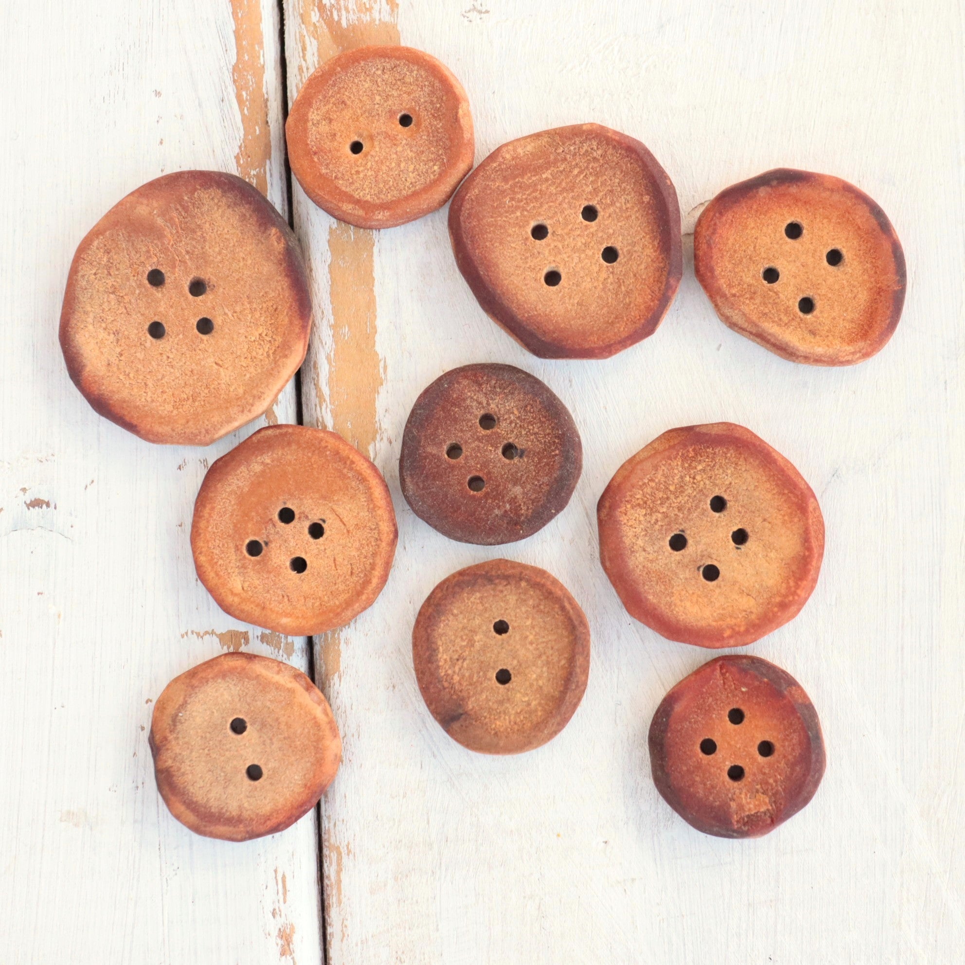 Hand carved Avocado pit Buttons, set of 10 with hand dyed pouch.