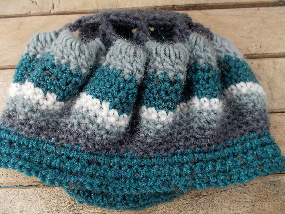 Crocheted winter hat in teal, grey and white wool