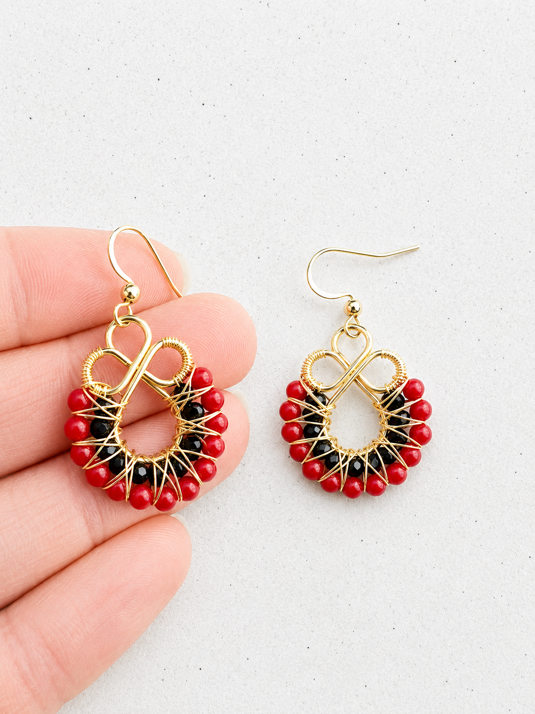 Gold onyx and red coral earrings