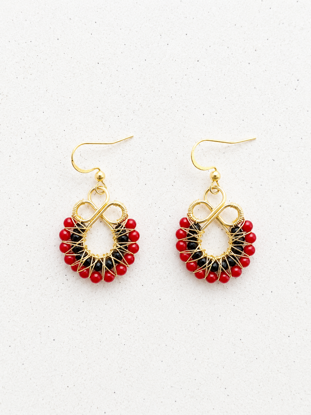 Gold onyx and red coral earrings