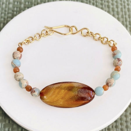 Vintage style beaded bracelet in toffee and sky blue on gold