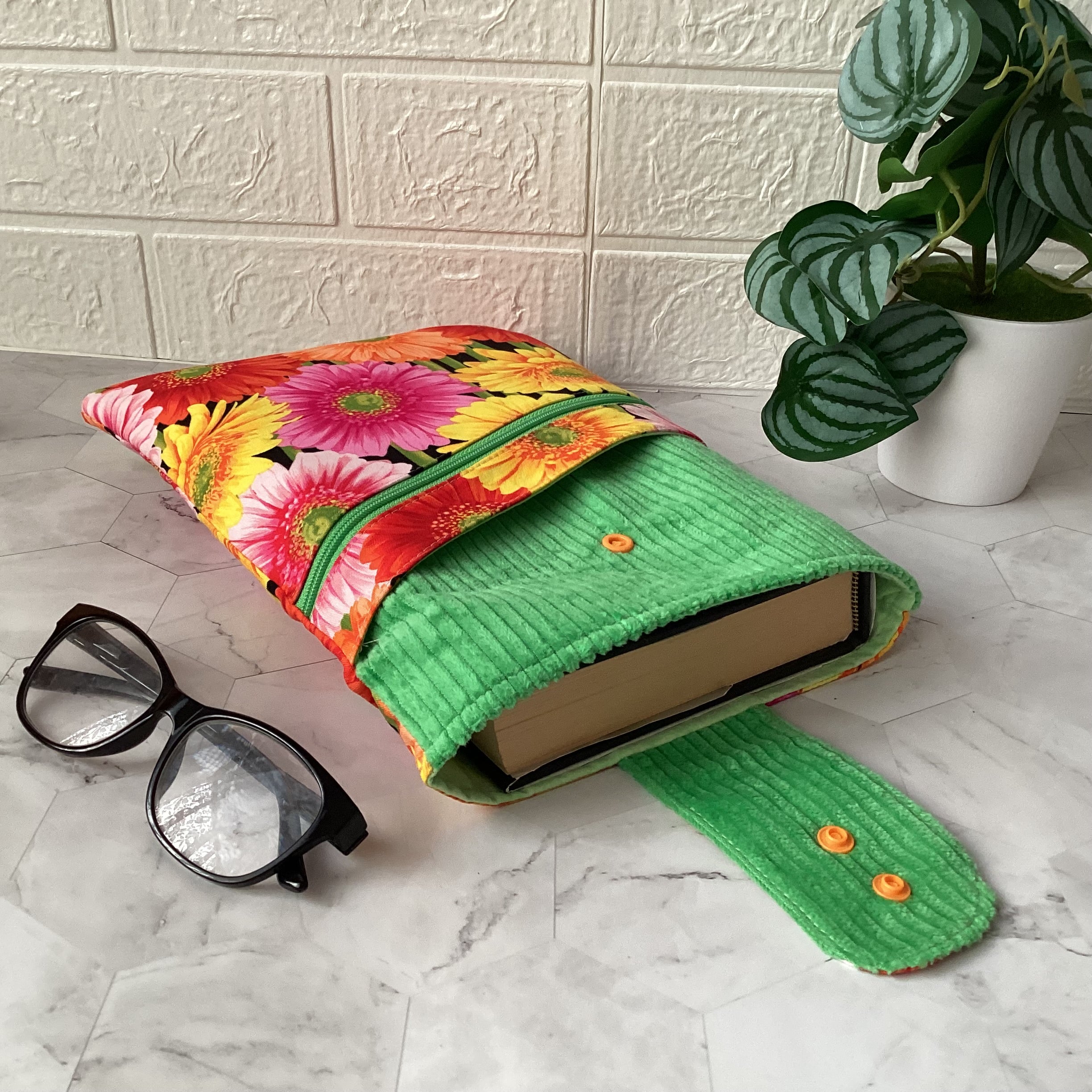 Colourful daisies book sleeve with 2 pockets. iPad, tablet pouch