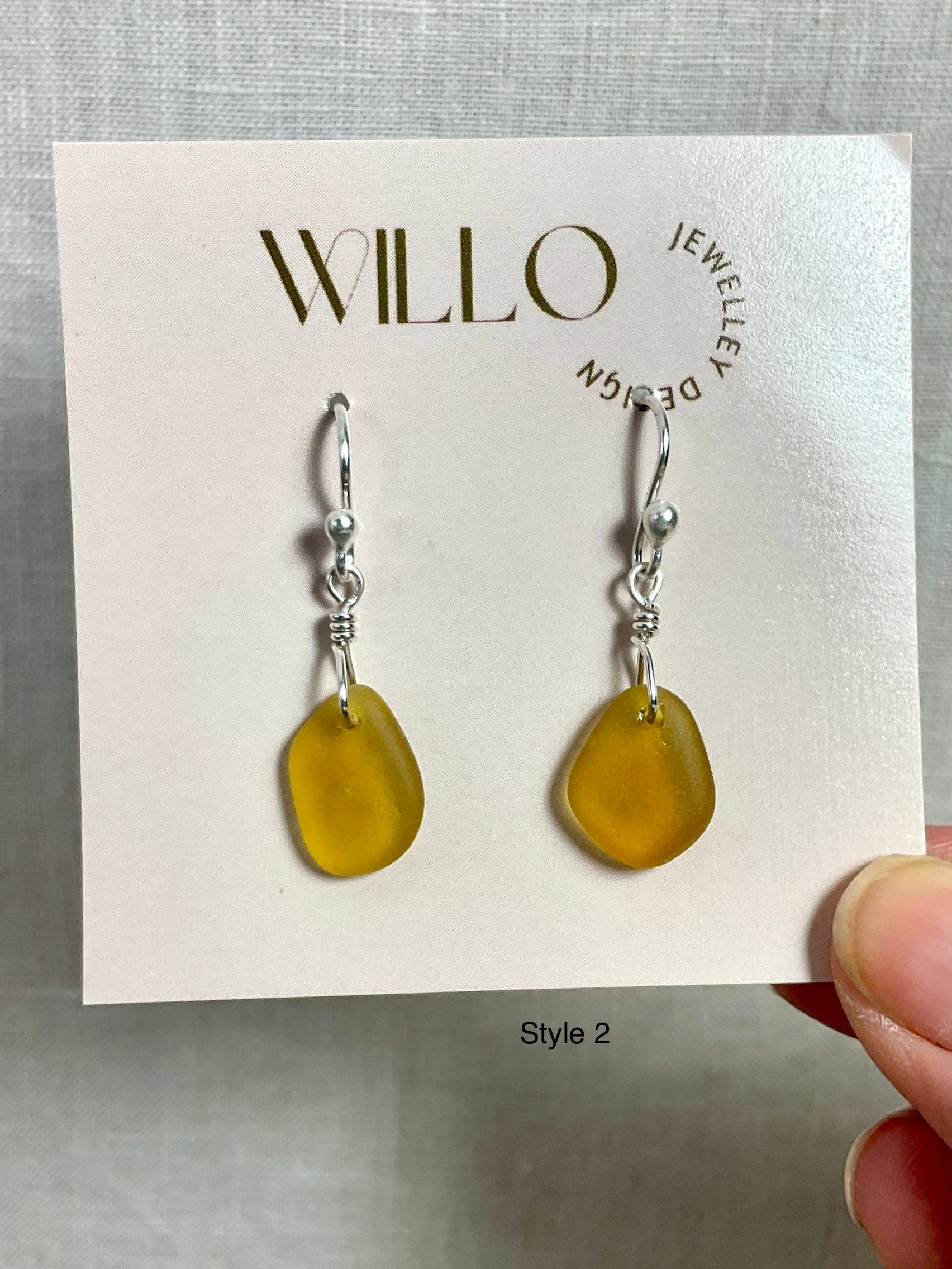 Amber sea glass earrings with argentium silver.