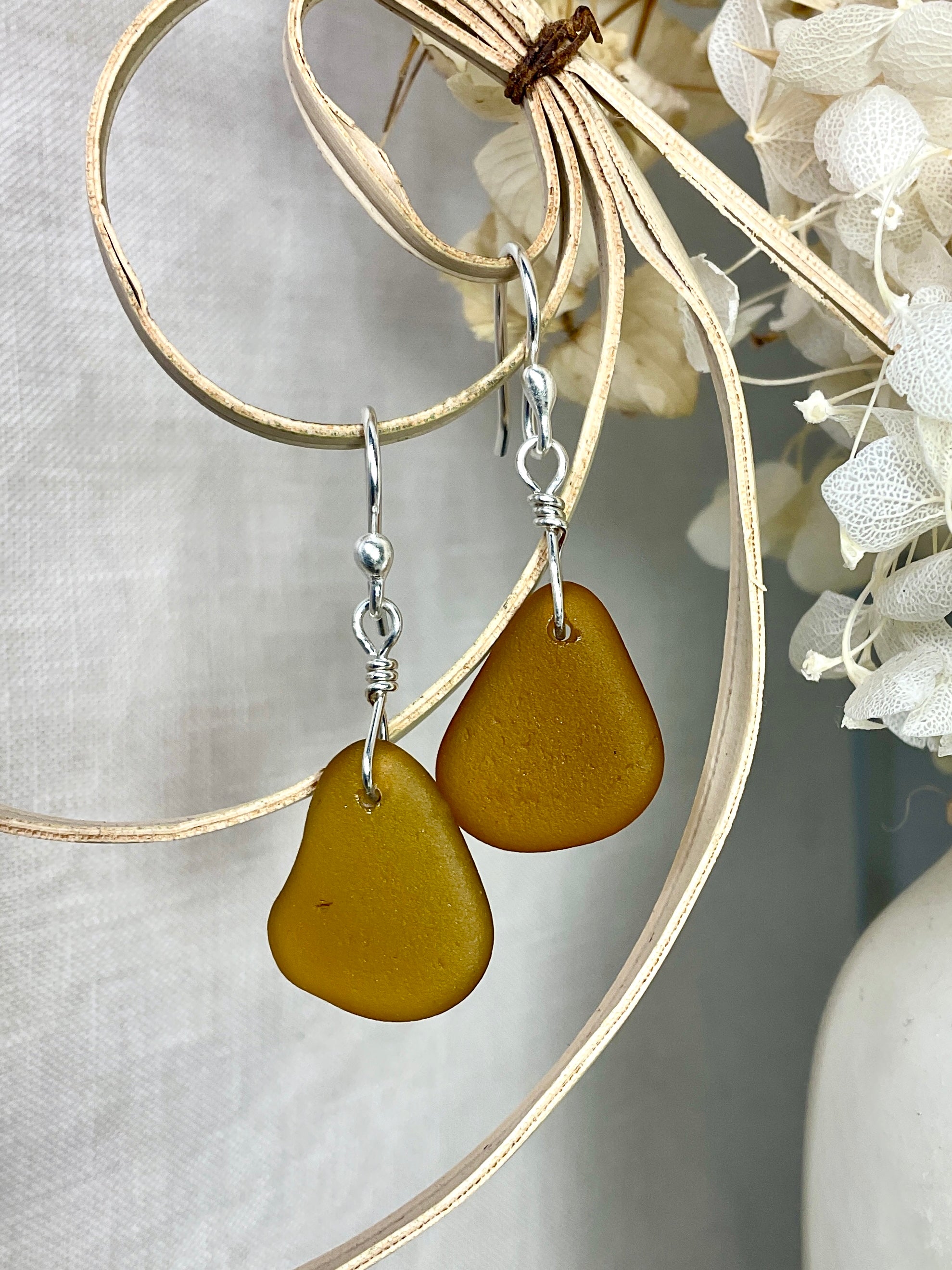 Amber sea glass earrings with argentium silver.